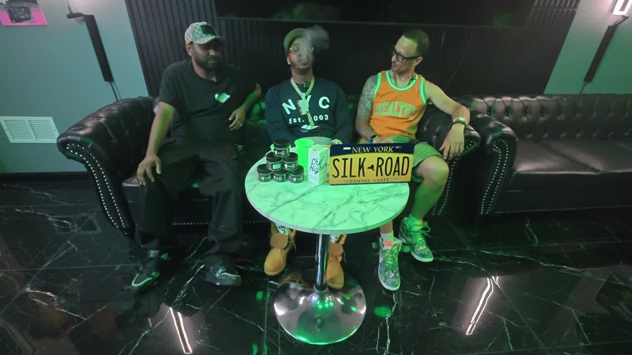 Private Q&A session in the Silk Road NYC lounge — seating around a marble table with New York Silk Road Empire State signage